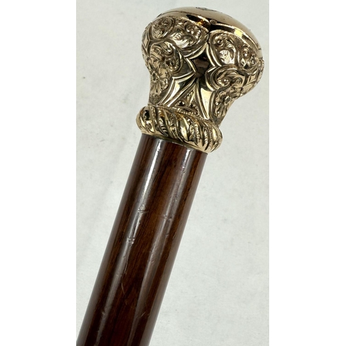 270 - A 19th Century hardwood walking stick with chased gilt metal cushion-shaped finial, 90cm.