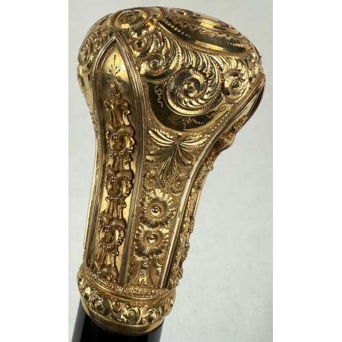 271 - A late Victorian presentation stick with tapering ebonised shaft, the gilt metal handle ornately dec... 