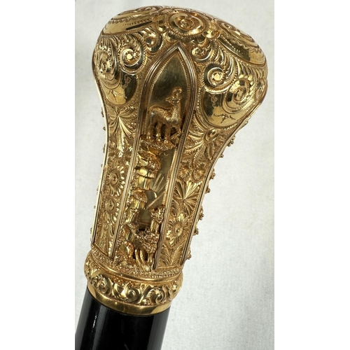 271 - A late Victorian presentation stick with tapering ebonised shaft, the gilt metal handle ornately dec... 