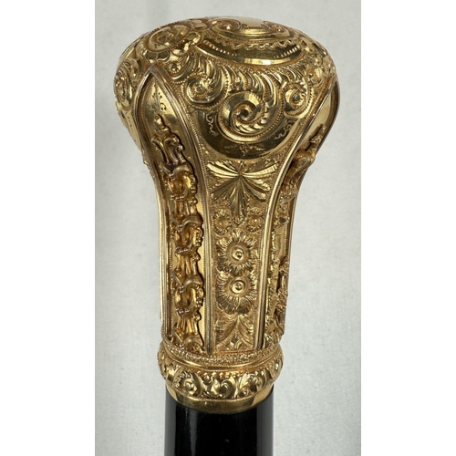 271 - A late Victorian presentation stick with tapering ebonised shaft, the gilt metal handle ornately dec... 