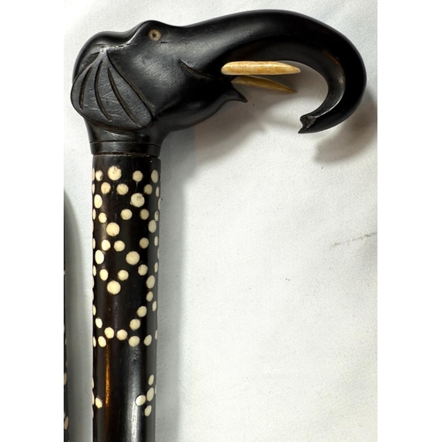 3 - A late 19th/early 20th Century Indian ebony walking stick with elephant handle and four similar, all... 