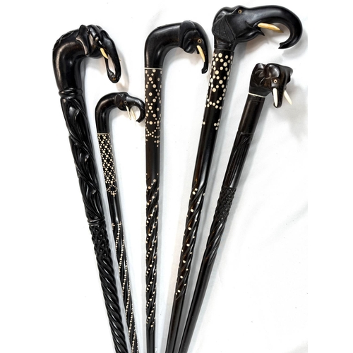 3 - A late 19th/early 20th Century Indian ebony walking stick with elephant handle and four similar, all... 