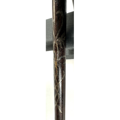 30 - An Edwardian ebonised walking stick with inlaid silver ribbon work and finial, 84cms, and two other ... 