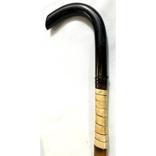 31 - Two vintage horn-handled sticks with white metal mounts, 91cms, and a twisted horn stick (3).