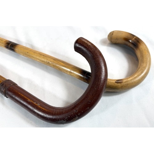 34 - A vintage Malacca stick with stitched leather handle, 92cms, and three others (4).