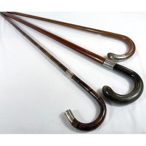 36 - A vintage Malacca cane walking stick with horn loop handle and silver mount, 95cm, and two others.