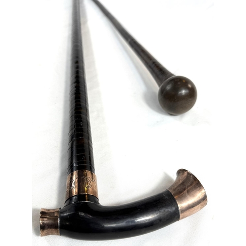 37 - A vintage horn walking stick with sectional shaft and gilt metal mounts, 102cm, and a similar stick.