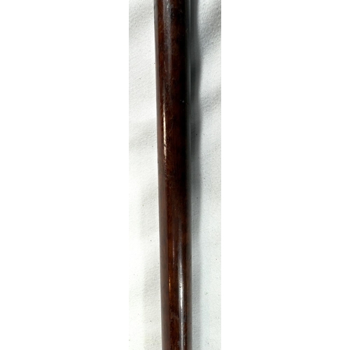 38 - An Edwardian slender hardwood stick with gilt inlaid steel handle, possibly Russian, 90cm.