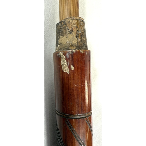 39 - A 19th Century Japanese bamboo walking cane with carved decoration of faunae, 89cm, and another with... 