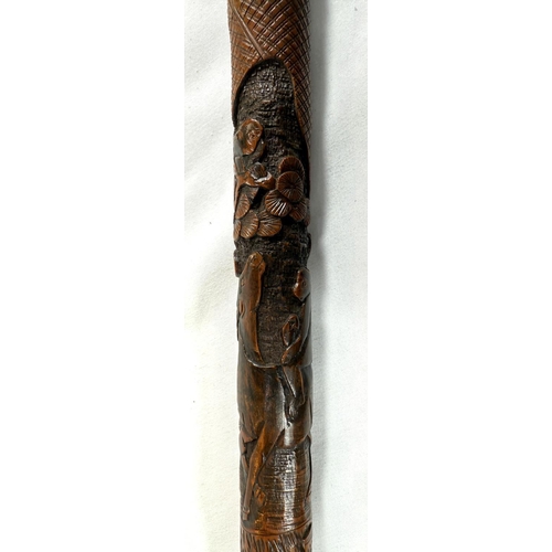 39 - A 19th Century Japanese bamboo walking cane with carved decoration of faunae, 89cm, and another with... 