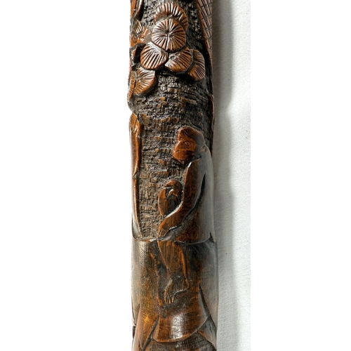 39 - A 19th Century Japanese bamboo walking cane with carved decoration of faunae, 89cm, and another with... 