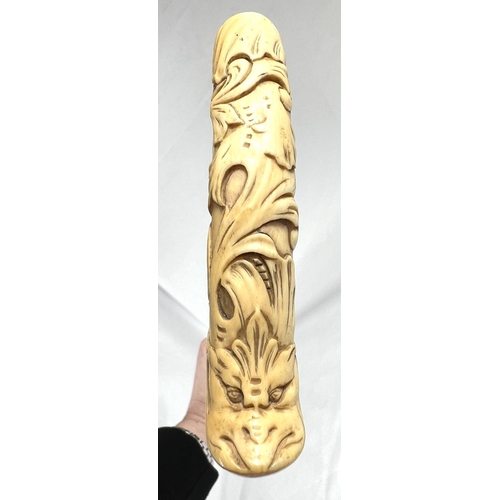 4 - A 19th Century ebony stick with carved ivory finial of a fierce dog, 89cms, and two other 19th Centu... 