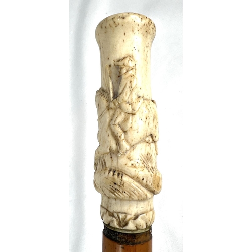 4 - A 19th Century ebony stick with carved ivory finial of a fierce dog, 89cms, and two other 19th Centu... 