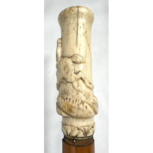 4 - A 19th Century ebony stick with carved ivory finial of a fierce dog, 89cms, and two other 19th Centu... 