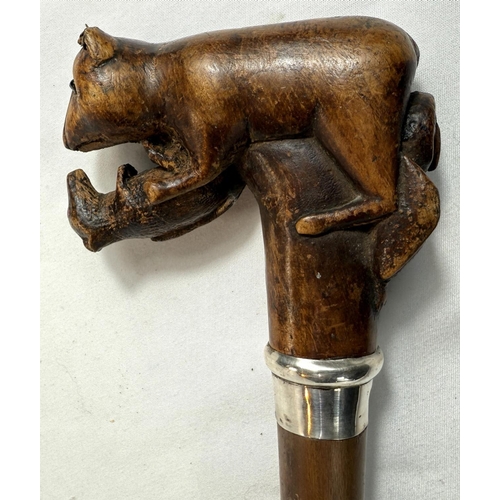 40 - A vintage branched wooden walking cane with carved rodent finial, 89cm.