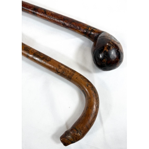 42 - A 19th Century colonial walking stick with animal head terminal and engraved decoration with Royal c... 