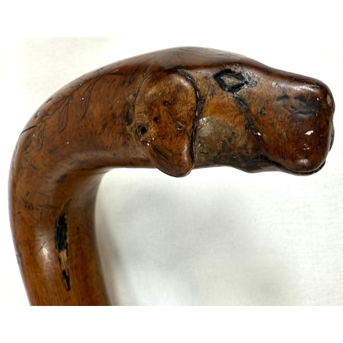 42 - A 19th Century colonial walking stick with animal head terminal and engraved decoration with Royal c... 