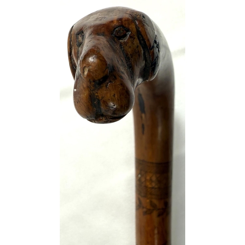 42 - A 19th Century colonial walking stick with animal head terminal and engraved decoration with Royal c... 