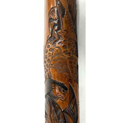 46 - A late 19th Century Japanese bamboo walking cane with carved naturalistic decoration, signed, 85cm.