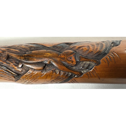 46 - A late 19th Century Japanese bamboo walking cane with carved naturalistic decoration, signed, 85cm.