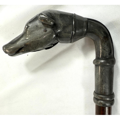 48 - A 19th Century stick with hardwood shaft and plated metal dog's head handle, 86cm.