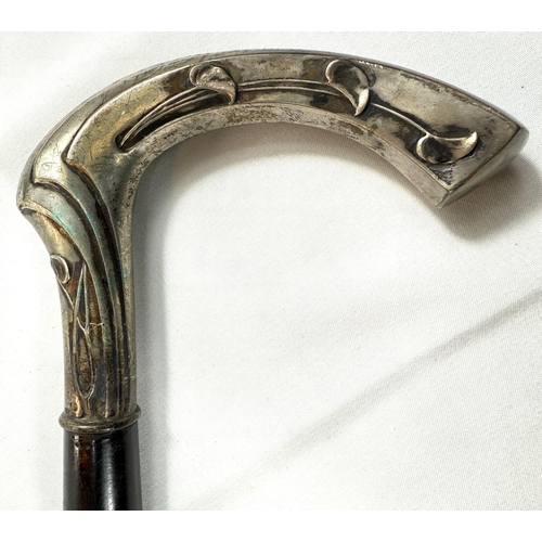 49 - An Art Nouveau continental walking stick with spiral ebony shaft and 800 standard silver handle, 90c... 