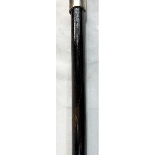 5 - A 19th Century ebonised stick with Japanese carved ivory handle and engraved silver band, 86cms, ano... 