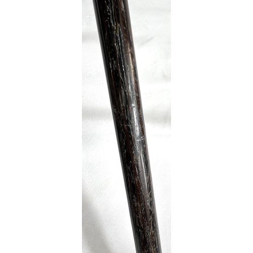 5 - A 19th Century ebonised stick with Japanese carved ivory handle and engraved silver band, 86cms, ano... 