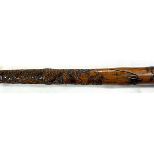 50 - A late 19th Century Japanese walking cane with carved decoration of insects, 88cm, and another (2).