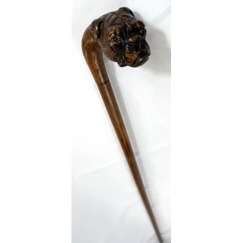 53 - A vintage walking stick with cane shaft and carved wood dog's head handle, 90cm.