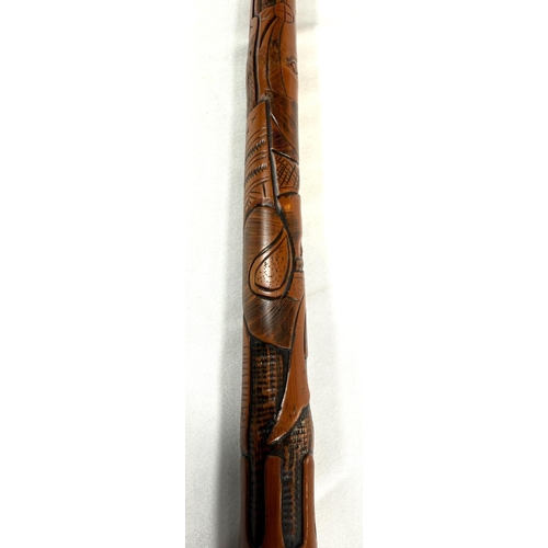 54 - A late 19th Century Japanese bamboo walking cane with carved decoration of a Samurai warrior, 87cm, ... 