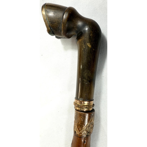 55 - A 19th Century sword stick with polished briar shaft and gilt metal mounted horn handle in the form ... 