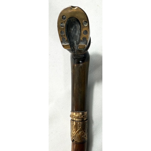 55 - A 19th Century sword stick with polished briar shaft and gilt metal mounted horn handle in the form ... 