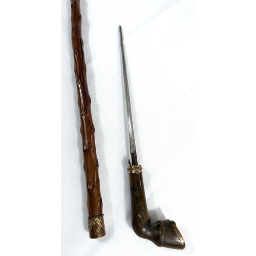 55 - A 19th Century sword stick with polished briar shaft and gilt metal mounted horn handle in the form ... 