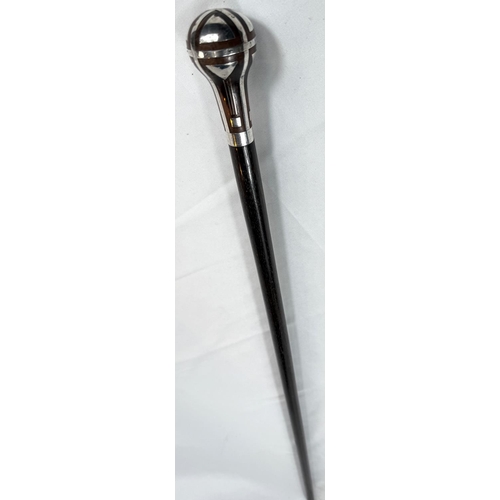 56 - A continental walking stick with hardwood shaft and silver inlaid decoration to the finial in the se... 