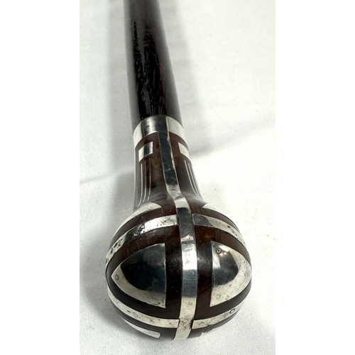 56 - A continental walking stick with hardwood shaft and silver inlaid decoration to the finial in the se... 