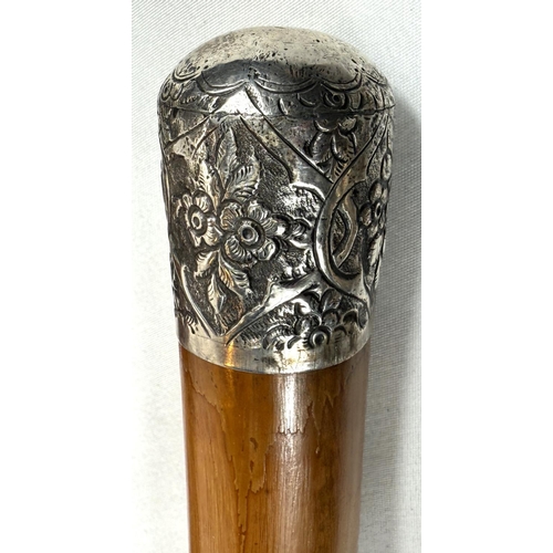 57 - A late 19th Century Malacca walking cane with silver finial, 89cm, and two similar sticks (3).