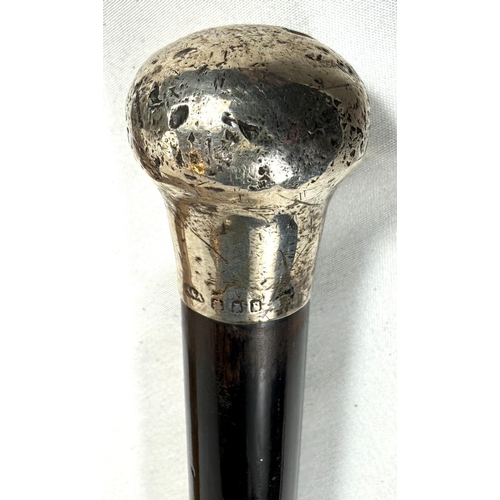 57 - A late 19th Century Malacca walking cane with silver finial, 89cm, and two similar sticks (3).