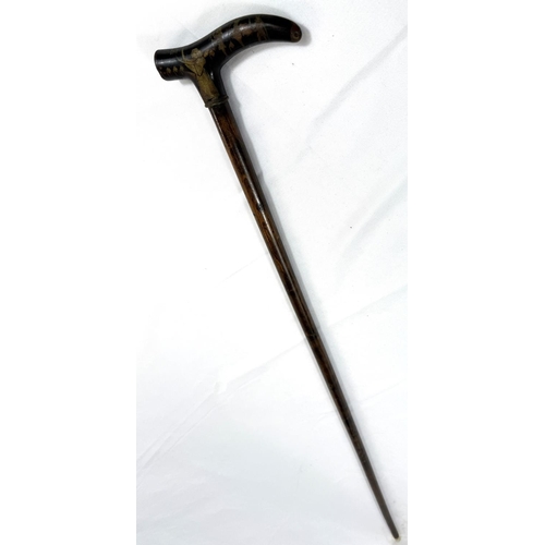 58 - A vintage walking stick with niello work brass handle with Egyptian motifs, 88cm.