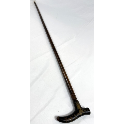 58 - A vintage walking stick with niello work brass handle with Egyptian motifs, 88cm.