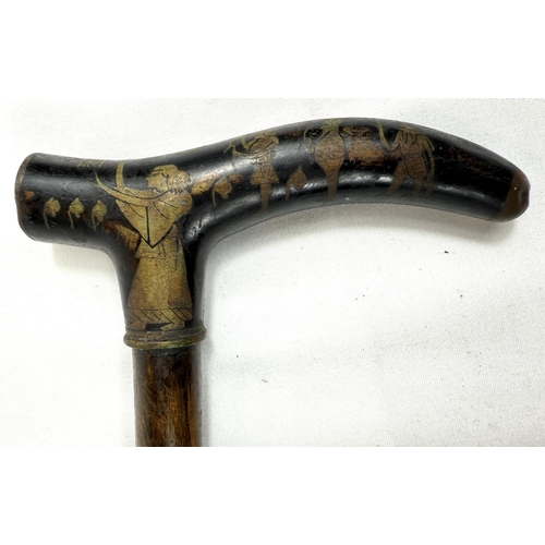 58 - A vintage walking stick with niello work brass handle with Egyptian motifs, 88cm.