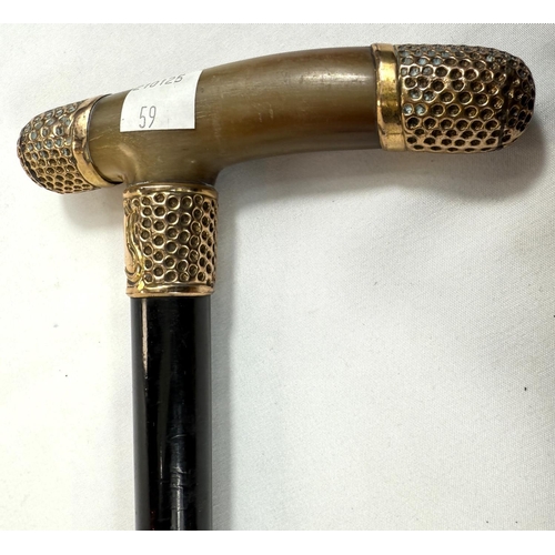 59 - A 19th Century horn-handled stick with gilt metal mounts and ebony shaft, 88cm, and a similar stick ... 