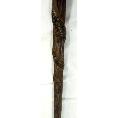 60 - A 19th Century continental vineyard stick with figural decoration, 90cm, and another with carved lio... 