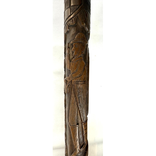 60 - A 19th Century continental vineyard stick with figural decoration, 90cm, and another with carved lio... 