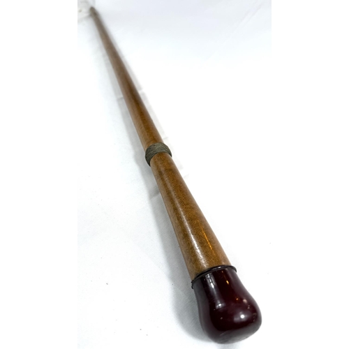 61 - A vintage polished sycamore walking cane with composition knop having a concealed torch, 90cm.