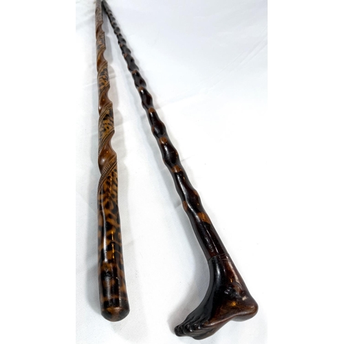 67 - A vintage polished wood stick with foot finial, 89cm, and another (2).