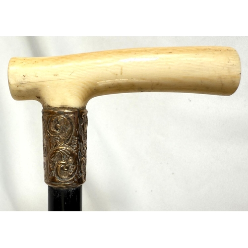 7 - A 19th Century walking stick with carved ivory elephant's head handle and silver band, 92cms, and si... 