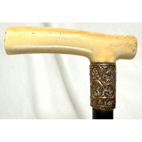 7 - A 19th Century walking stick with carved ivory elephant's head handle and silver band, 92cms, and si... 