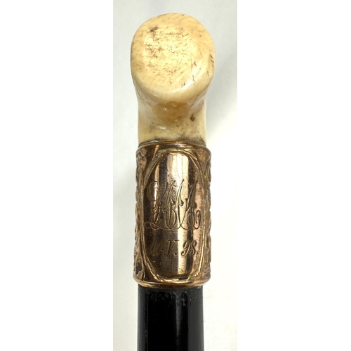 7 - A 19th Century walking stick with carved ivory elephant's head handle and silver band, 92cms, and si... 