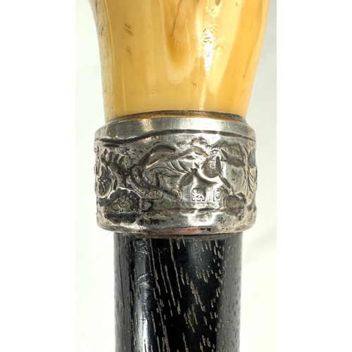 7 - A 19th Century walking stick with carved ivory elephant's head handle and silver band, 92cms, and si... 